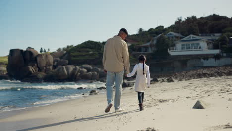 Beach,-walking-and-father-holding-hands-with-kid