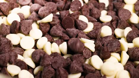 dark and white chocolate chips being mixed together