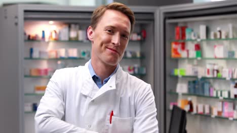 Handsome-pharmacist-looking-at-medicine