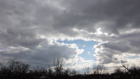 sunlight behind sliding clouds in overcast sky. timelapse