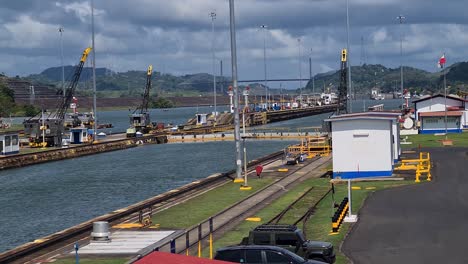 panama canal miraflores locks, buildings and waterway