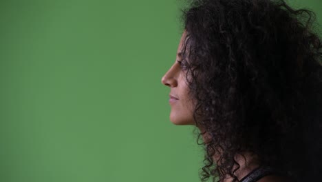profile view of young beautiful hispanic woman thinking ready for gym