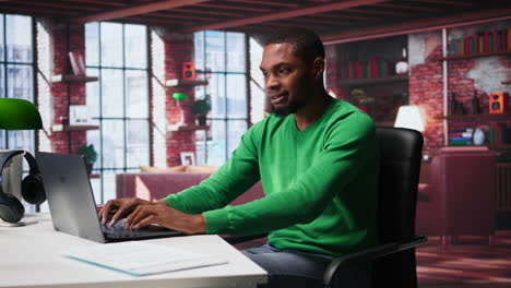 vertical video black man doing remote work feeling uneasy and anxious at desk