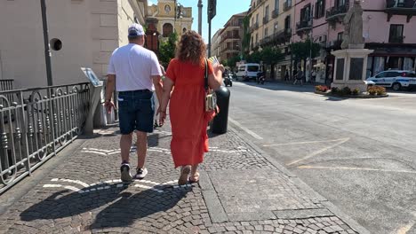 couple strolling through sorrento, encountering another pair