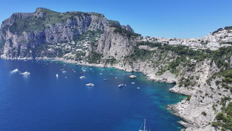 capri island at naples in campania italy. beach landscape. tourism landmark. capri island at naples in campania italy. gulf of naples skyline. coastal cityscape. mediterranean sea.