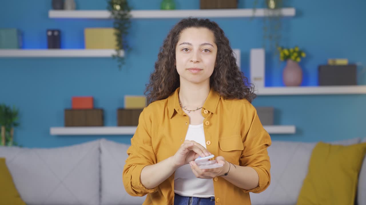 The young woman takes care of herself, well-groomed.