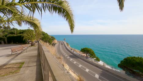 road-with-sea-view,-little-traffic,-sliding-sideways