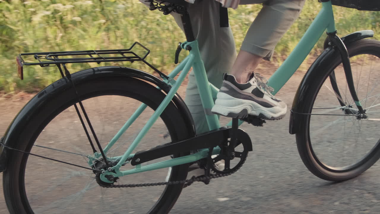 Unrecognizable Woman Riding Bike In Summer
