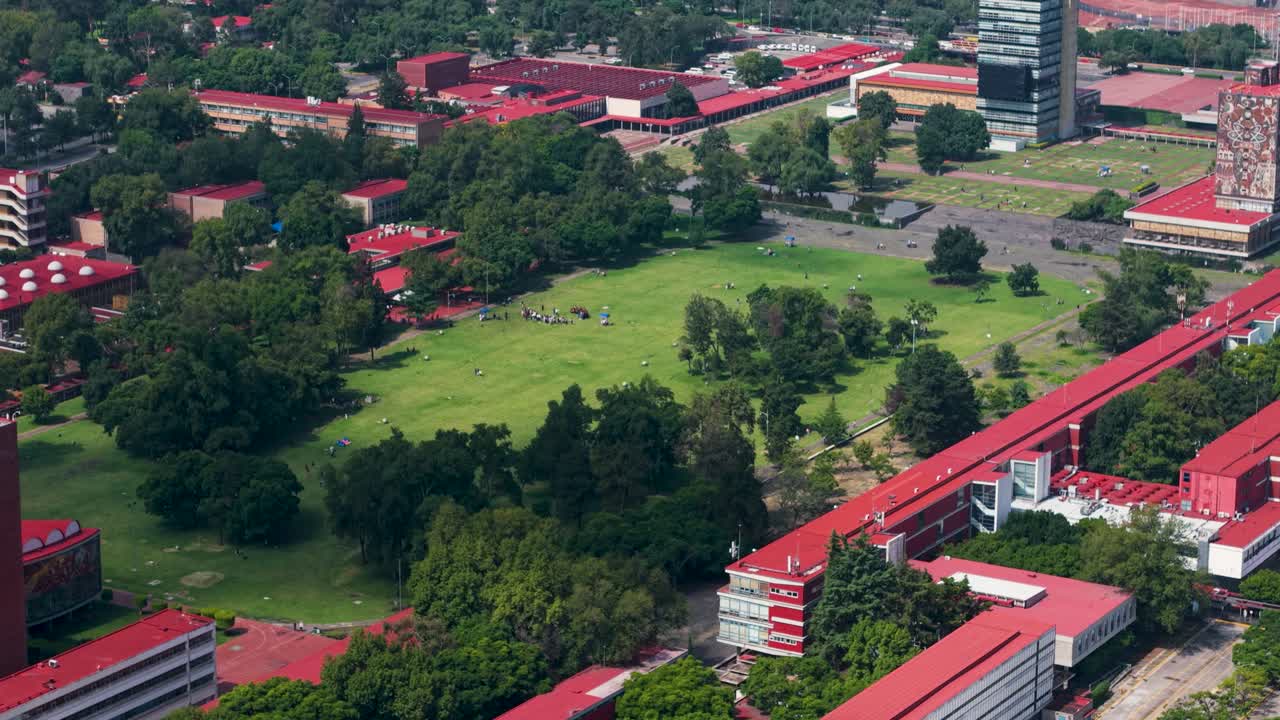Gliding with a drone above UNAM campus on a clear afternoon, Mexico CIty