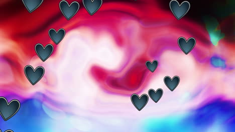 animación de corazones negros que se mueven sobre un fondo multicolor