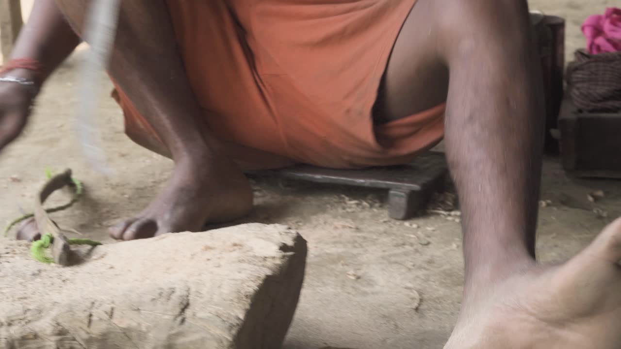 Manual handsaw chopping by a indian carpenter for a living