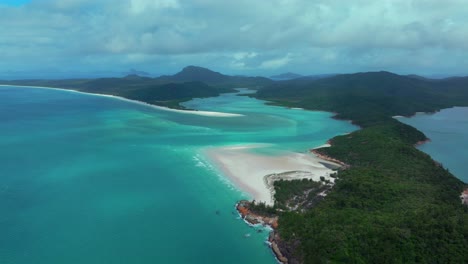 Hill-Inlet-Lookout-aerial-drone-scenic-flight-Whitsundays-Island-North-end-Whitehaven-beach-QLD-Australia-boats-tourists-Port-of-Airlie-National-Park-clear-turquoise-ocean-water-sun-clouds-backwards