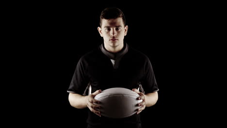 Serious-rugby-player-with-ball