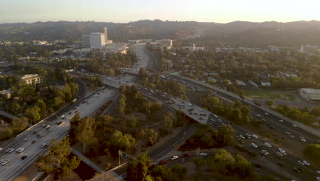 Aerial-of-busy-traffic-filled-highways-of-the-101-and-405-in-the-San-Fernando-Valley-of-Los-Angeles