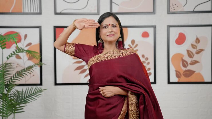 Indian woman saluting in saree