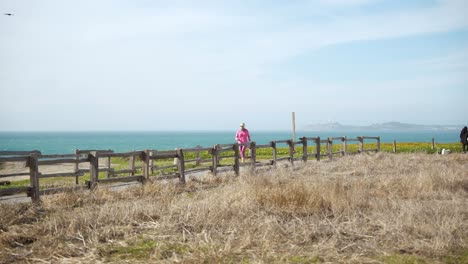 a person running by the beach