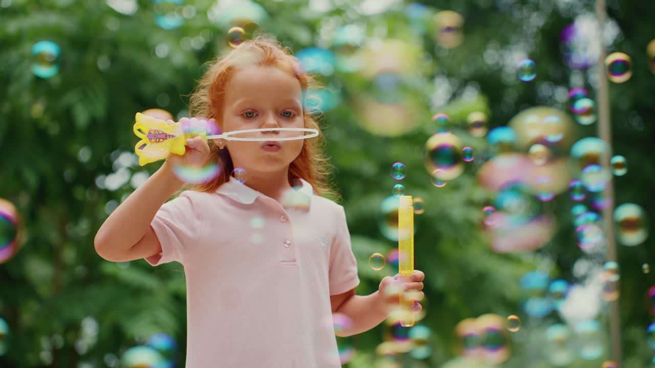 Little Girl Playing with Bubbles