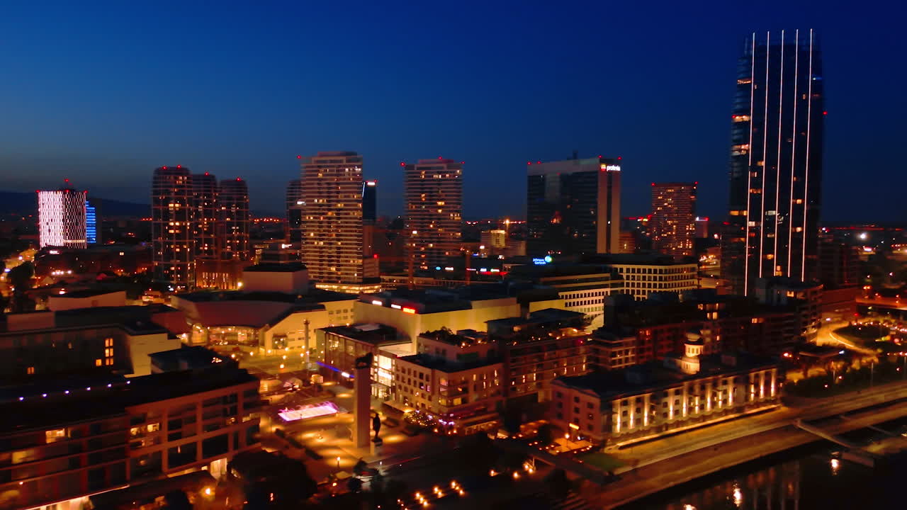 Night view of Bratislava city skyline. Bratislava's skyline illuminated at night, showcasing modern architecture and vibrant city life along the river