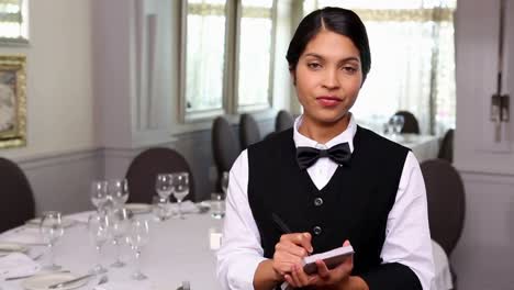 Pretty-waitress-taking-an-order
