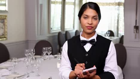 pretty waitress taking an order