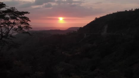aerial 4k drone sunset shot of the highway leading to baguio city in the philippines