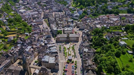 smooth vertically tilted down drone movement over the town hall of morlaix town, brittany, france.