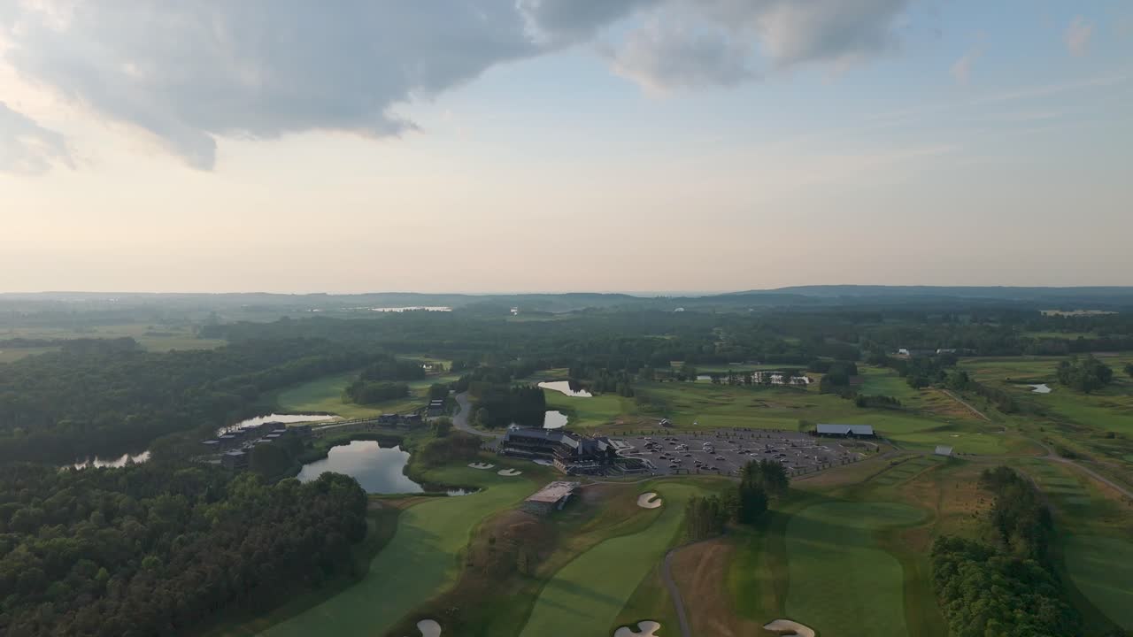 Scenic aerial view of a golf course fairway on a tranquil sunny day