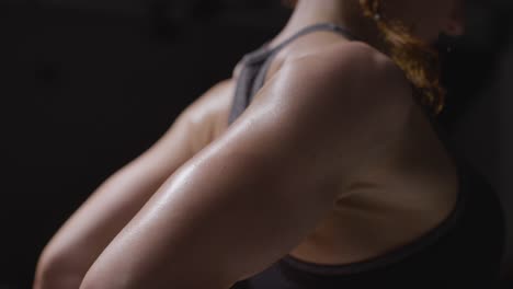 Close-Up-Studio-Shot-Showing-Mature-Woman-Wearing-Gym-Fitness-Clothing-Doing-Stretching-Exercises-2