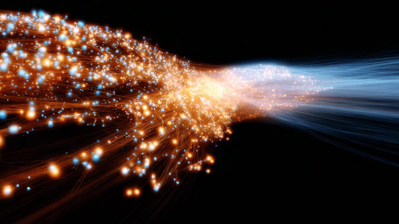 A mesmerizing explosion of light and color flows from a central point, creating vibrant trails of orange and blue particles against a dark backdrop, illustrating the beauty of energy dynamics