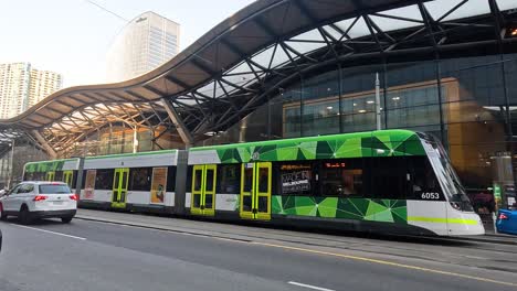 tram and cars crossing road in melbourne