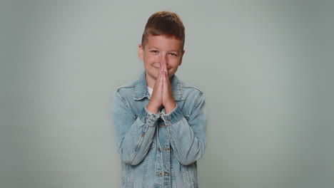 toddler boy child kid praying, looking upward and making wish, asking for help , begging apology