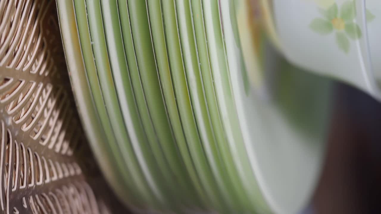 Close-up of Stacked Green and White Plates