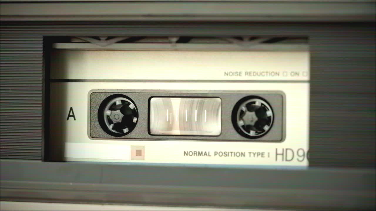 Close-up of an Audio Cassette in a Player