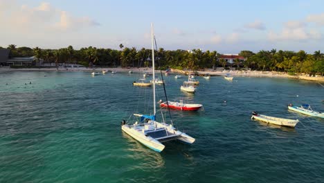 Drone-shot-of-the-shoreline-Akumal-with-the-sun-reflecting-on-the-sea