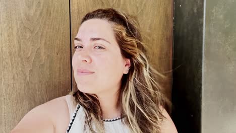 close-up portrait of a woman vlogging indoors