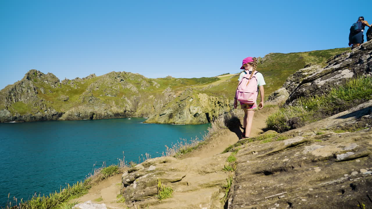 Girl Hiking on Coastal Rocks