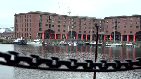 albert docks in liverpool, focus pull on chain in foreground