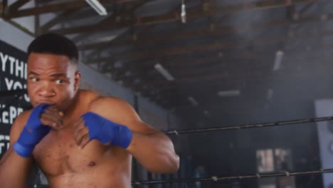 video of fit african american man boxing at gym