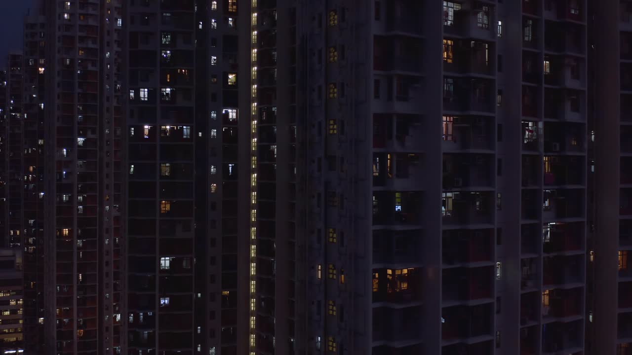 Night View of a Densely Populated Hong Kong Apartment Building