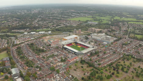 rising aerial shot of watford fc stadium