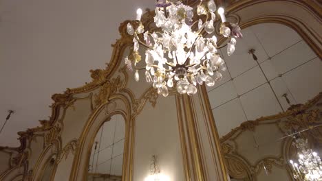 french style interiors of a museum with crystal chandeliers hanging