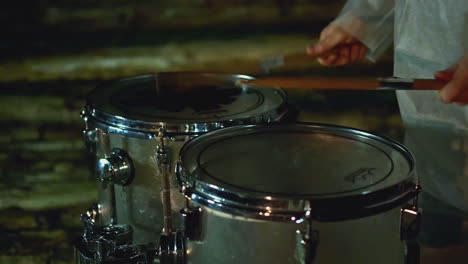 drummer playing drums at night