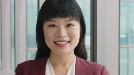 portrait asian business woman smiling looking confident independent female in office executive enjoying successful career in corporate leadership company manager at work