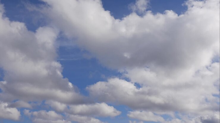 Blue sky white clouds. Puffy fluffy white clouds. Cumulus cloud scape timelapse. Summer blue sky time lapse. Dramatic majestic amazing blue sky. Soft white clouds form. Clouds time lapse background