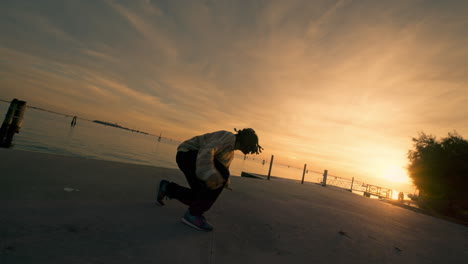 sunset breakdancing by the water