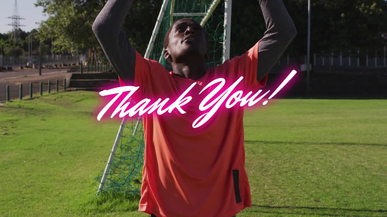 Holding ball, goalkeeper in orange jersey with animation of Thank You! text