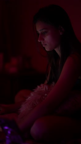 young woman in a dark room