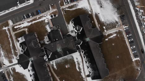 a winter drone shot of the town hall and former cafeteria at the fairfield hills hospital asylum in newtown, connecticut