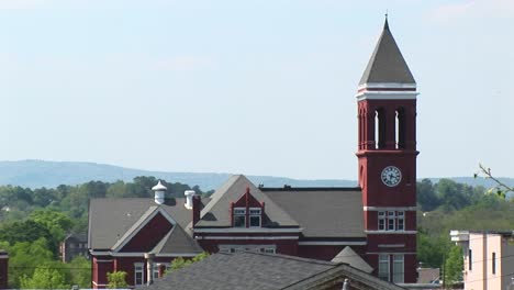 An-Old-Clock-Tower-Stands-Tall-Above-The-Town'S-Rooftops