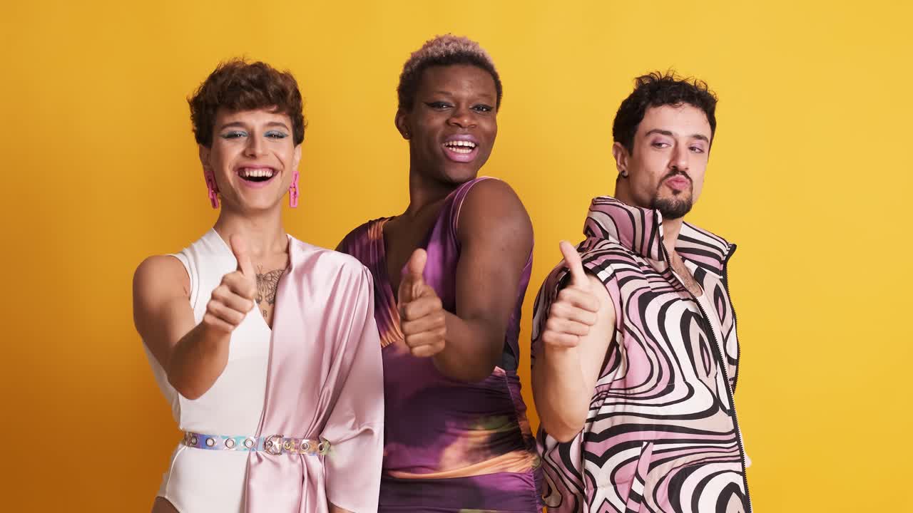 Three trans men gesturing to be fine with the thumb up